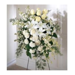 White and pale yellow floral standing spray on an easel