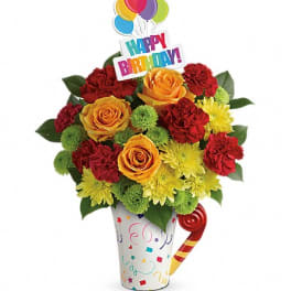 Birthday bouquet in a decorated cup with balloons and a Happy Birthday sign
