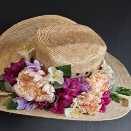 Straw hat decorated with colorful flowers