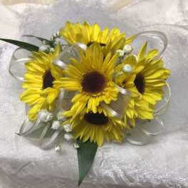 Yellow daisy bouquet with white ribbon and small white filler flowers