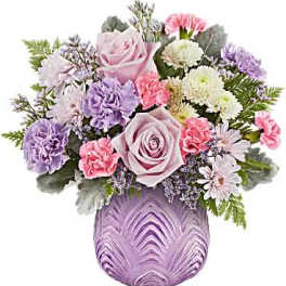 Pink and lavender bouquet in a purple vase