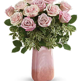 Pink roses arranged in a tall pink vase