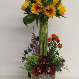 Tall sunflower arrangement with orchids and roses in a rustic wood box with ladybug accents