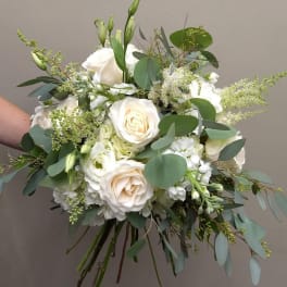 White rose bridal bouquet with eucalyptus and small white blooms