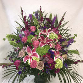 Large mixed bouquet with pink lilies and roses in a vase