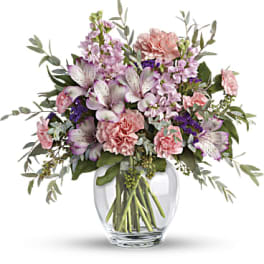 Pink and lavender mixed bouquet in a clear glass vase