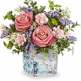 Pink roses and carnations in a painted glass vase