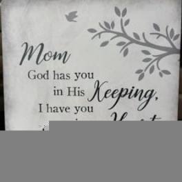 Decorative sign with a condolence message for Mom