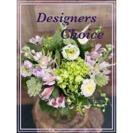 Mixed bouquet in a glass vase with white and lavender blooms