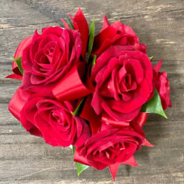 Small bouquet of red roses with ribbon wrap