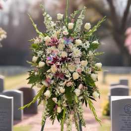 Large standing floral spray with white roses and lilies