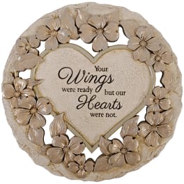Heart-shaped memorial plaque with beige flowers and the words "Your Wings were ready but our Hearts were not."