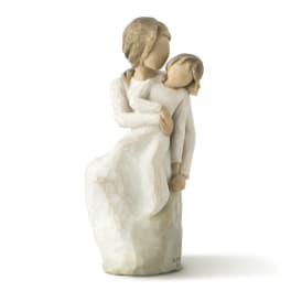 Carved figurine of a woman holding a child