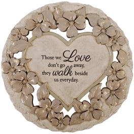 Heart-shaped memorial plaque with floral border and sympathy message