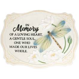 Memorial plaque with dragonfly and white flowers