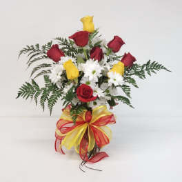Bouquet of red and yellow roses with white daisies and fern filler
