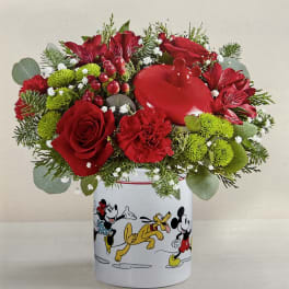 Red flowers arranged in a Mickey Mouse tin container