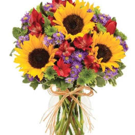 Bouquet of sunflowers, red flowers, and purple daisies in a glass vase