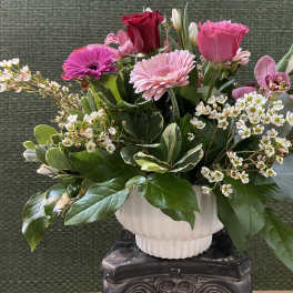 Pink and red mixed bouquet in a white vase