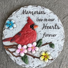 Decorative memorial plaque with a red cardinal and painted flowers