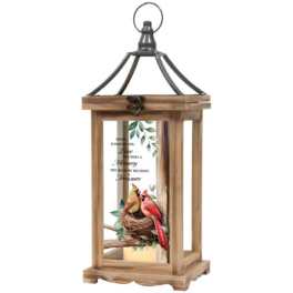 Wooden lantern with a bird nest and two birds inside