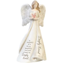 White angel figurine holding a pink heart with memorial text on the robe