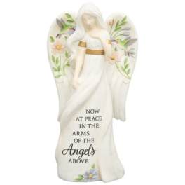 White angel figurine with floral accents and memorial text