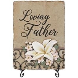 Decorative plaque reading "Loving Father" with white flowers