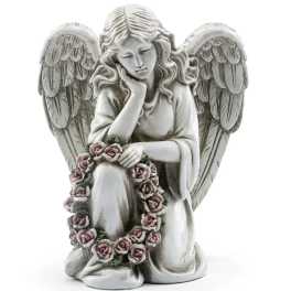 Stone angel figurine holding a pink rose wreath
