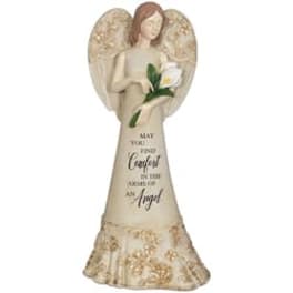 Angel figurine holding a white flower and a memorial message