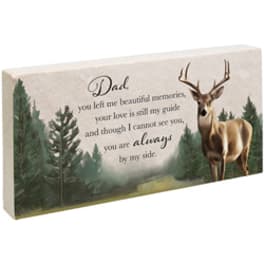 Memorial plaque with a deer and forest scene and a message for Dad