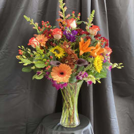 Colorful mixed bouquet in a clear glass vase