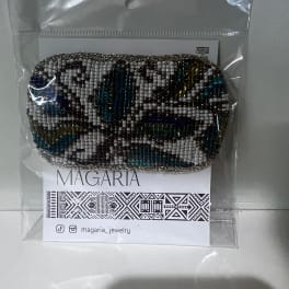 Beaded coin purse in a clear plastic package