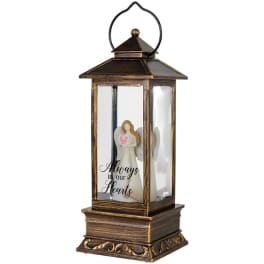 Wooden memorial lantern with an angel figurine inside