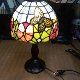Stained glass table lamp with a butterfly design