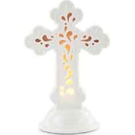 White cross-shaped floral display with orange and yellow accents