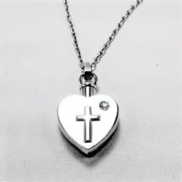 Heart-shaped silver pendant necklace with a cross and small gem