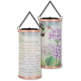 Two hanging memorial candle lanterns with floral and hummingbird designs