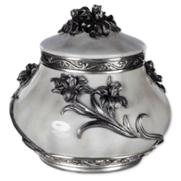 Ornate silver urn with raised floral decoration and a fitted lid
