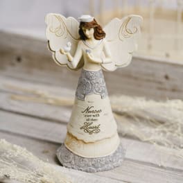 Decorative angel figurine holding a small bird