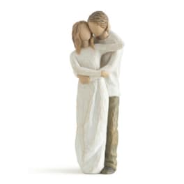 Wooden figurine of a couple embracing