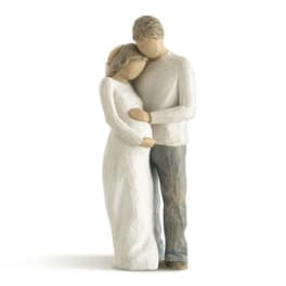 Carved figurine of a couple embracing