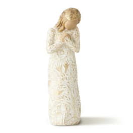 Cream-colored angel figurine with hands clasped in prayer