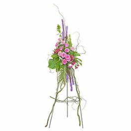 Tall floral standing spray with pink blooms and purple spikes