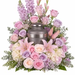 Pastel pink and lavender floral urn arrangement with a metal urn