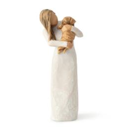 Wooden angel figurine holding a small child