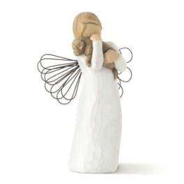 Angel figurine in a white dress holding a small child