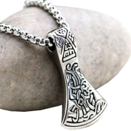 Silver pendant necklace with an engraved axe-shaped charm on a chain