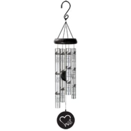 Hanging metal wind chime with silver tubes and a black heart medallion