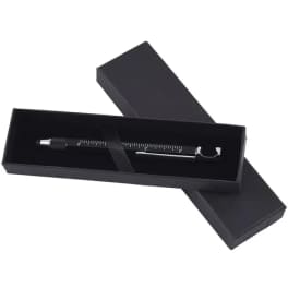 Black gift box holding a pen-like tool on a white background